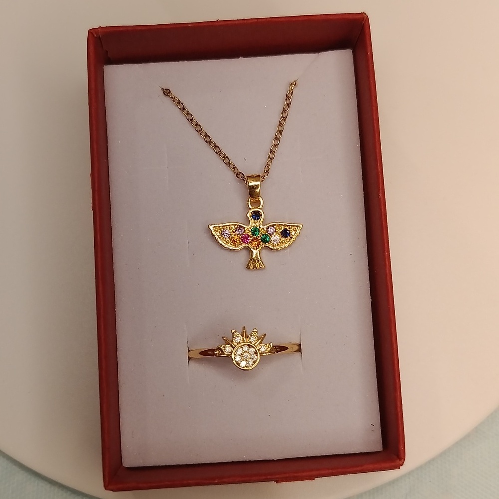 Gold and colored gemstone bird with ring set